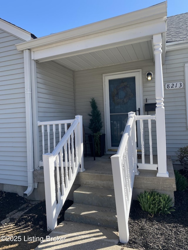 entrance to property featuring covered porch