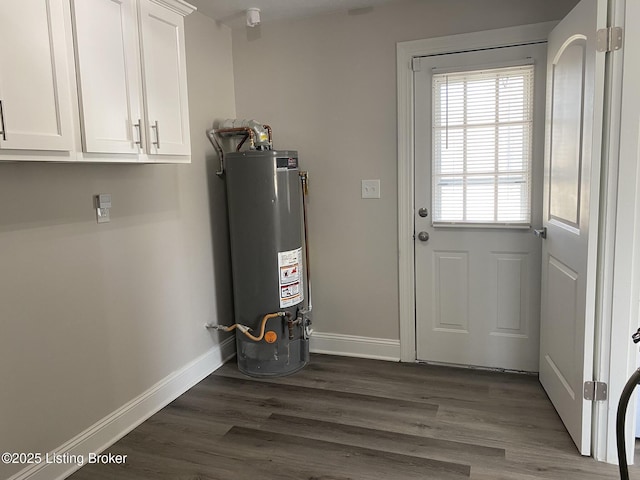 utility room featuring water heater