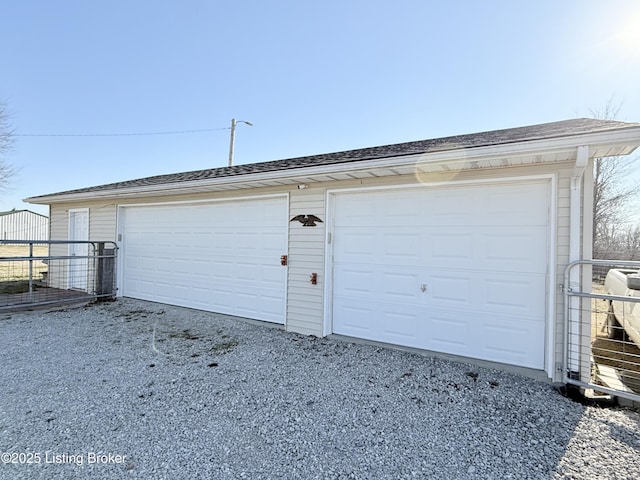 garage with fence