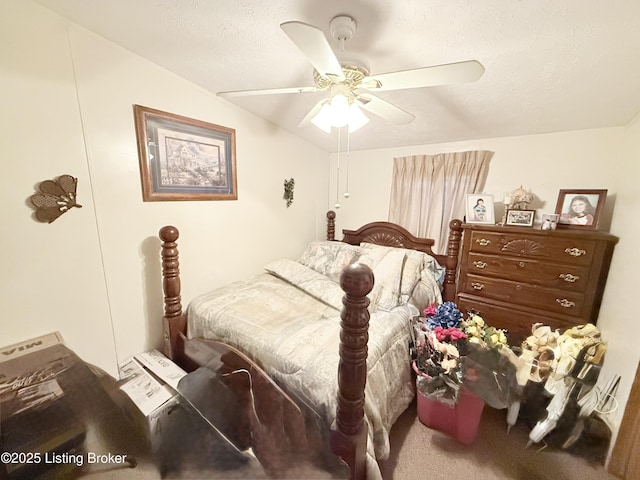 carpeted bedroom featuring a textured ceiling and ceiling fan