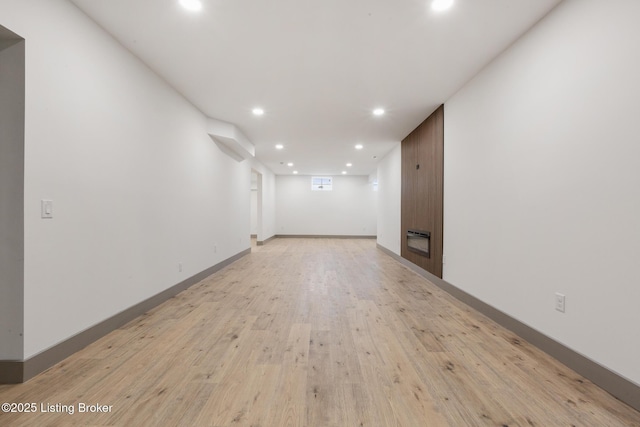 interior space with recessed lighting, baseboards, and light wood-style floors