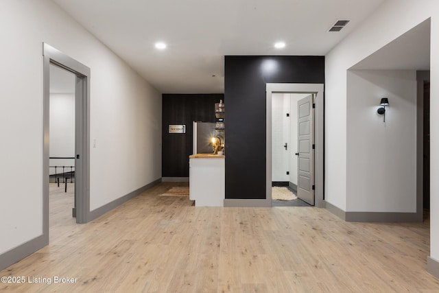 interior space with recessed lighting, baseboards, visible vents, and light wood-type flooring