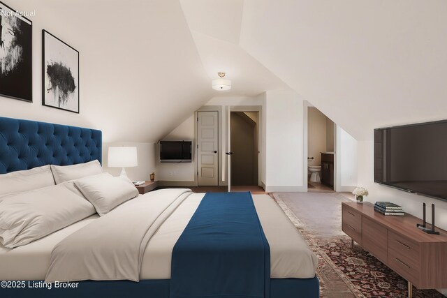 bedroom with baseboards, lofted ceiling, carpet floors, and ensuite bath