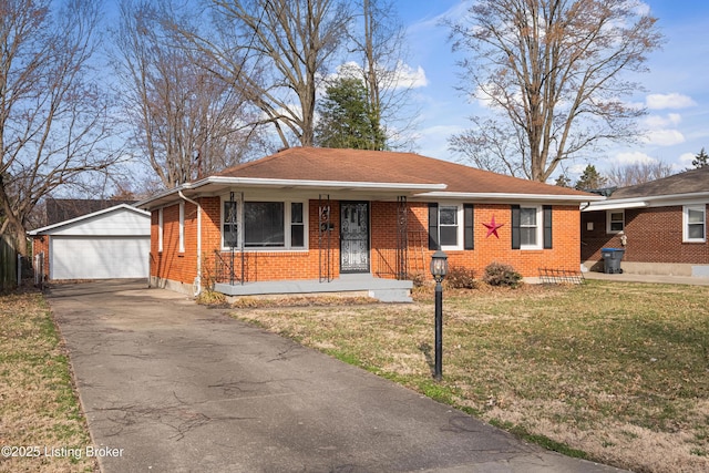 view of front of house featuring brick siding, a porch, a front lawn, and an outdoor structure