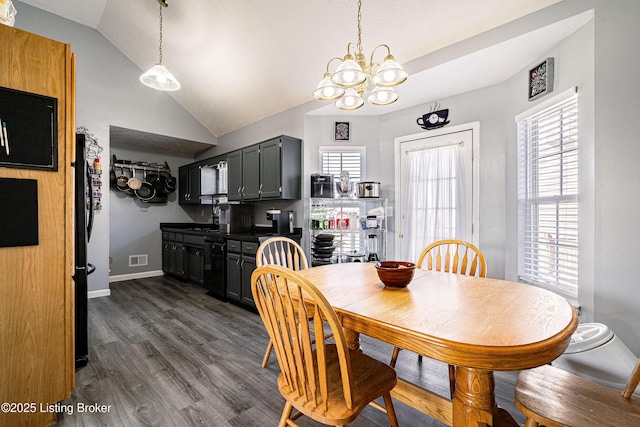 dining space with dark wood-style floors, visible vents, baseboards, lofted ceiling, and a notable chandelier