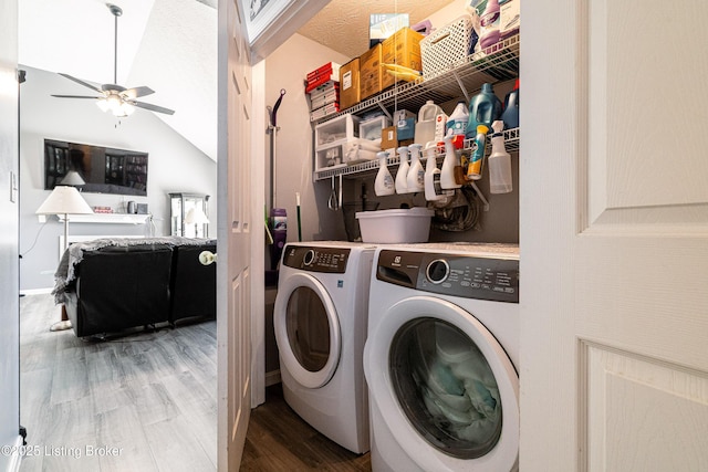 laundry area with separate washer and dryer, wood finished floors, a ceiling fan, and laundry area