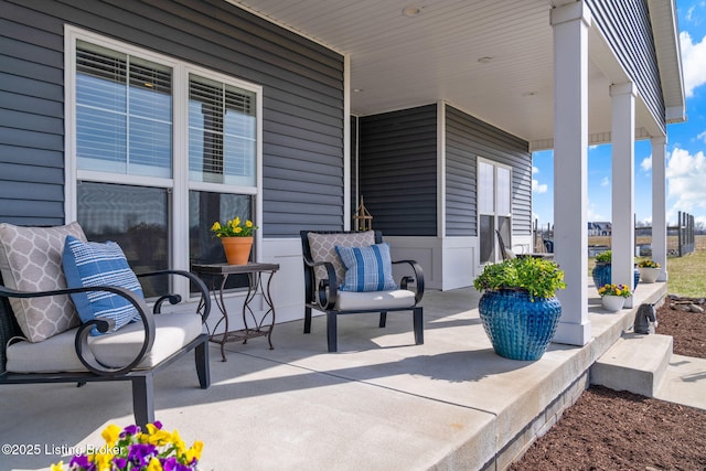 view of patio with a city view and a porch