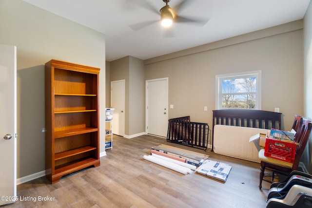 bedroom with baseboards and wood finished floors