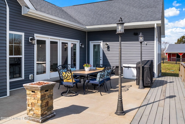 view of patio / terrace featuring outdoor dining space and a deck