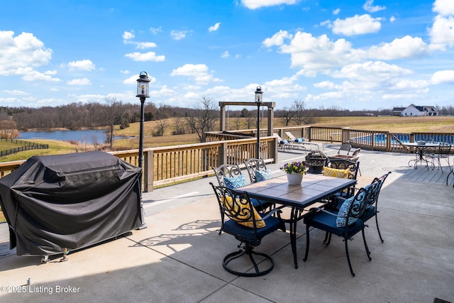 view of patio featuring a swimming pool, grilling area, and outdoor dining area