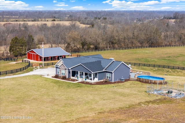 birds eye view of property featuring a rural view