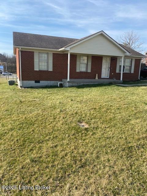 ranch-style home featuring crawl space, brick siding, and a front yard