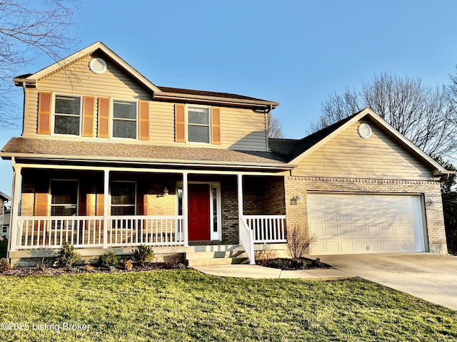 traditional-style house with a front lawn, driveway, a porch, an attached garage, and brick siding