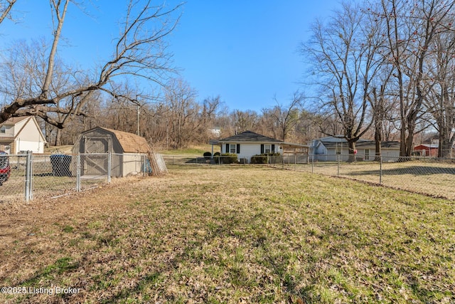 view of yard with a storage unit, an outdoor structure, and fence private yard