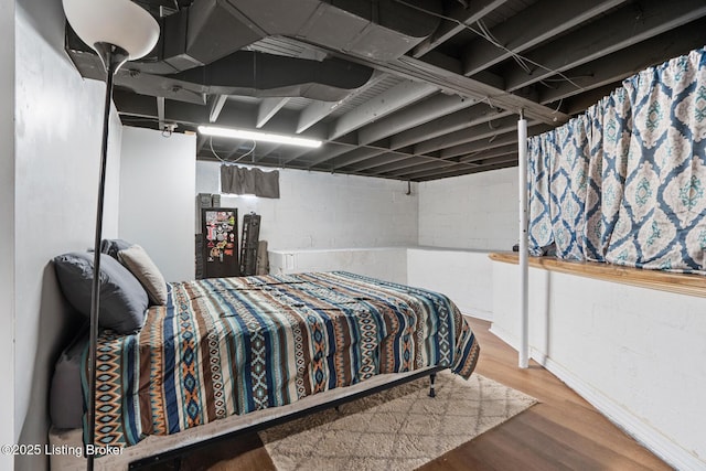 bedroom featuring wood finished floors