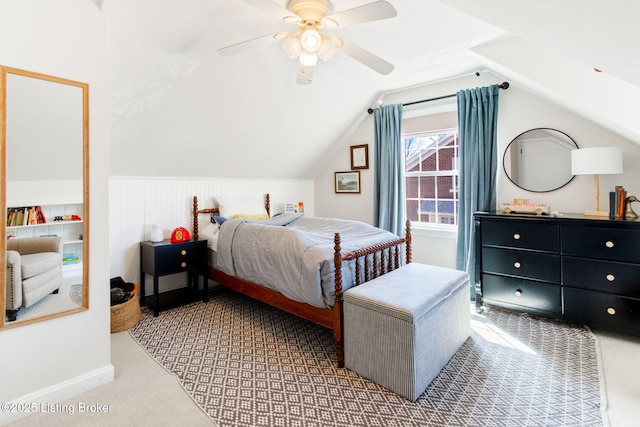 carpeted bedroom featuring lofted ceiling and ceiling fan