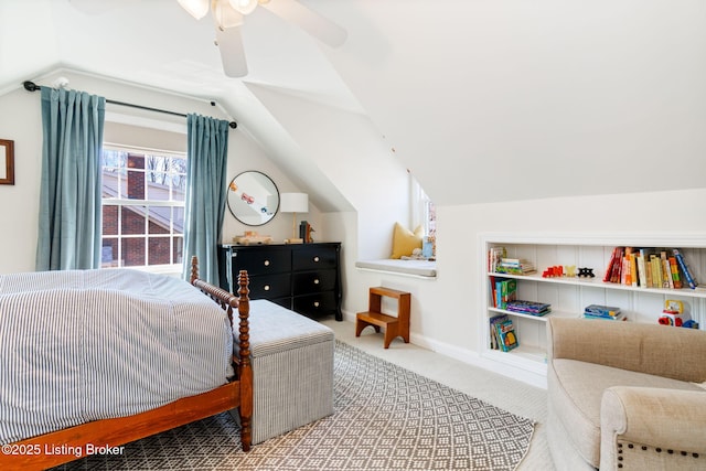 carpeted bedroom featuring baseboards, a ceiling fan, and vaulted ceiling