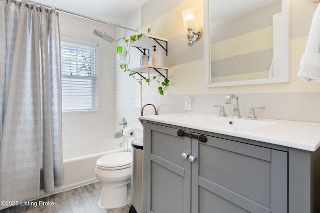 full bath with shower / tub combo with curtain, toilet, vanity, and wood finished floors