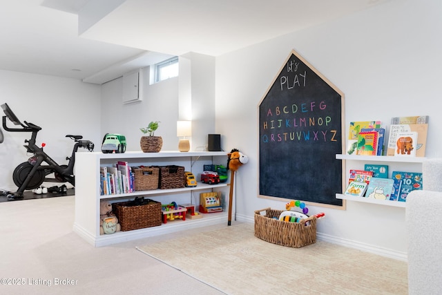 playroom featuring carpet and baseboards