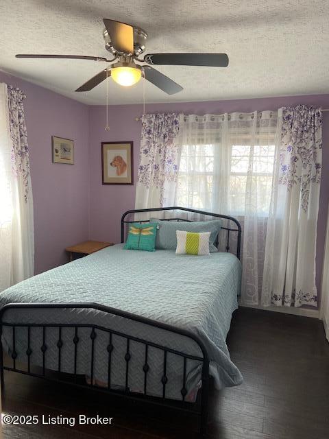 bedroom featuring a textured ceiling and ceiling fan