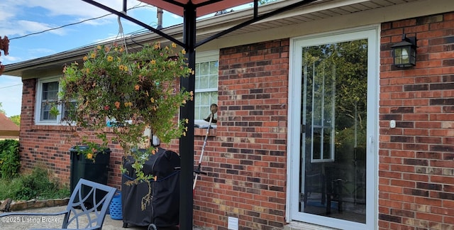 exterior space featuring brick siding