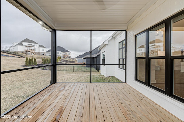 unfurnished sunroom featuring a residential view