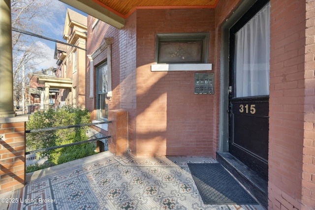 entrance to property with brick siding