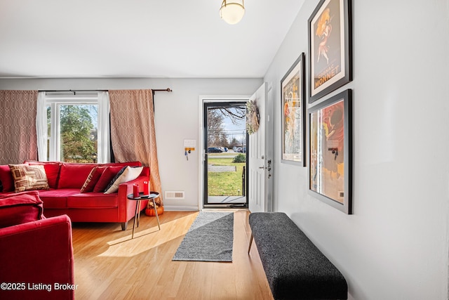 entrance foyer featuring wood finished floors and visible vents