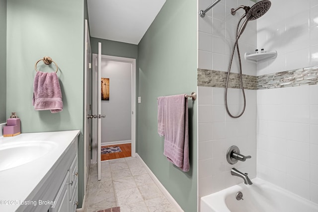 full bath with vanity, shower / bathing tub combination, baseboards, and marble finish floor