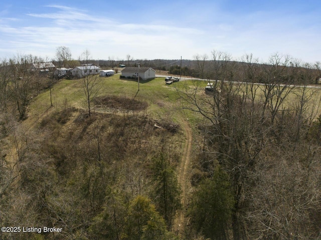 birds eye view of property featuring a rural view