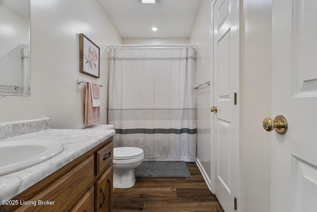 full bath featuring toilet, recessed lighting, a shower with curtain, wood finished floors, and vanity