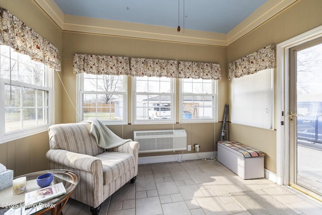 sunroom / solarium with a healthy amount of sunlight and a wall mounted AC