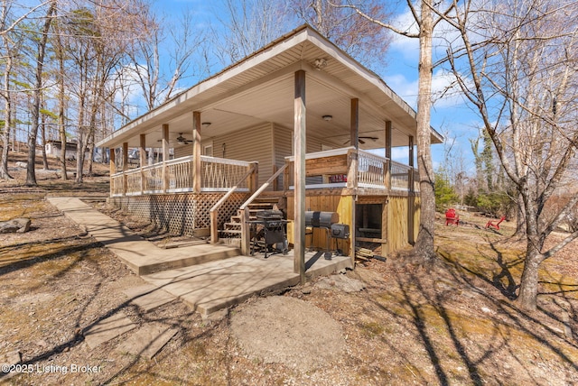 exterior space featuring covered porch and stairs