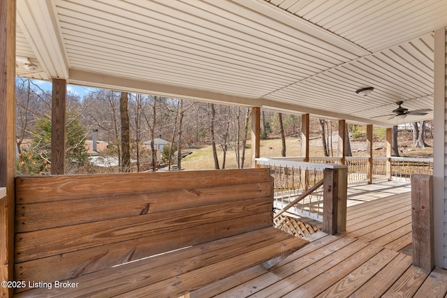 wooden terrace with a ceiling fan