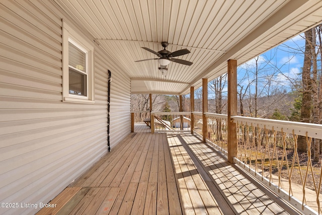 wooden terrace featuring a ceiling fan