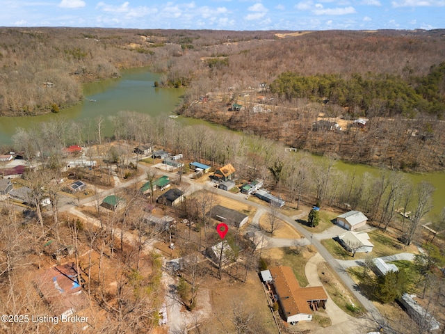 aerial view with a wooded view and a water view