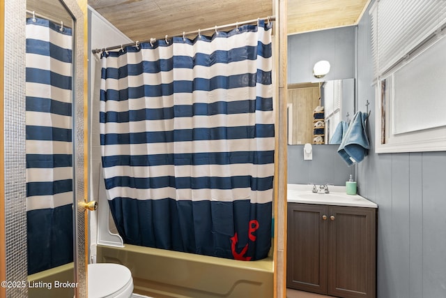 bathroom with toilet, vanity, and shower / bath combo