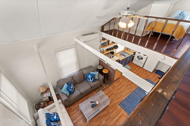 living room with wood finished floors and ceiling fan