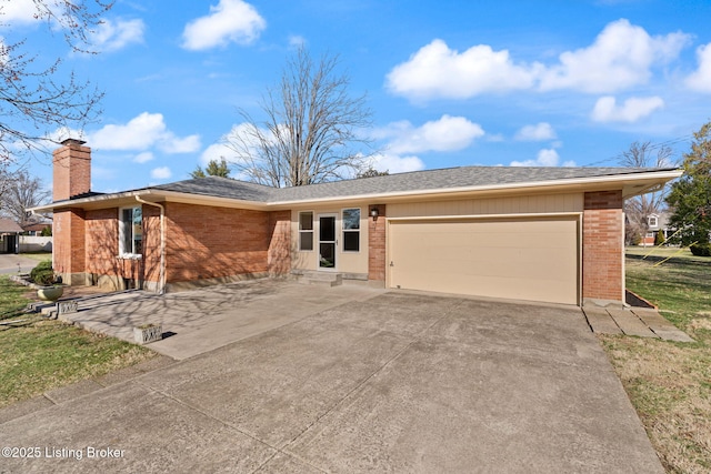 single story home featuring concrete driveway, an attached garage, brick siding, and a chimney