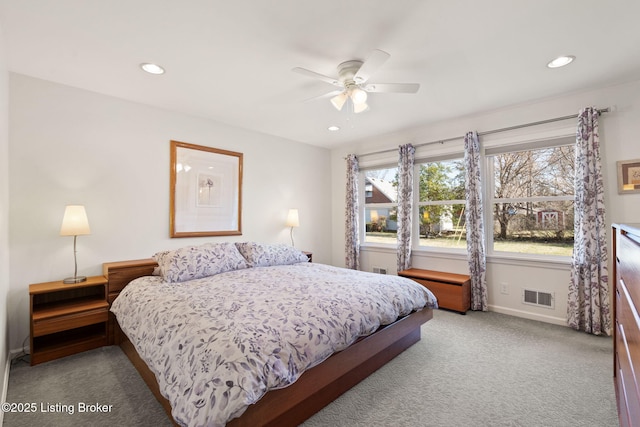 carpeted bedroom with visible vents, recessed lighting, a ceiling fan, and baseboards