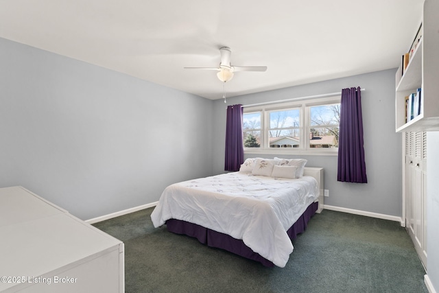 bedroom with baseboards, dark carpet, and ceiling fan