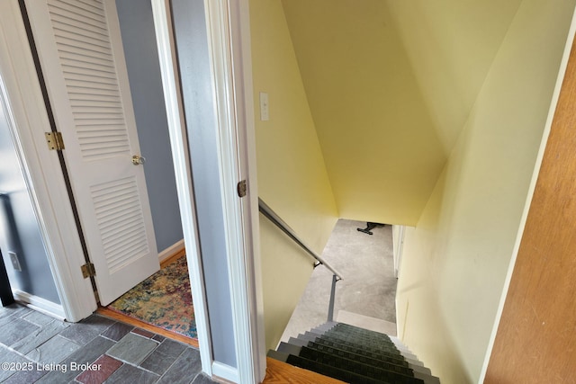 stairway featuring baseboards