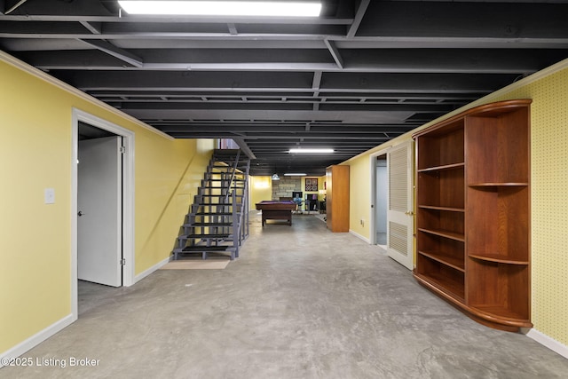 finished basement featuring baseboards, billiards, and stairs