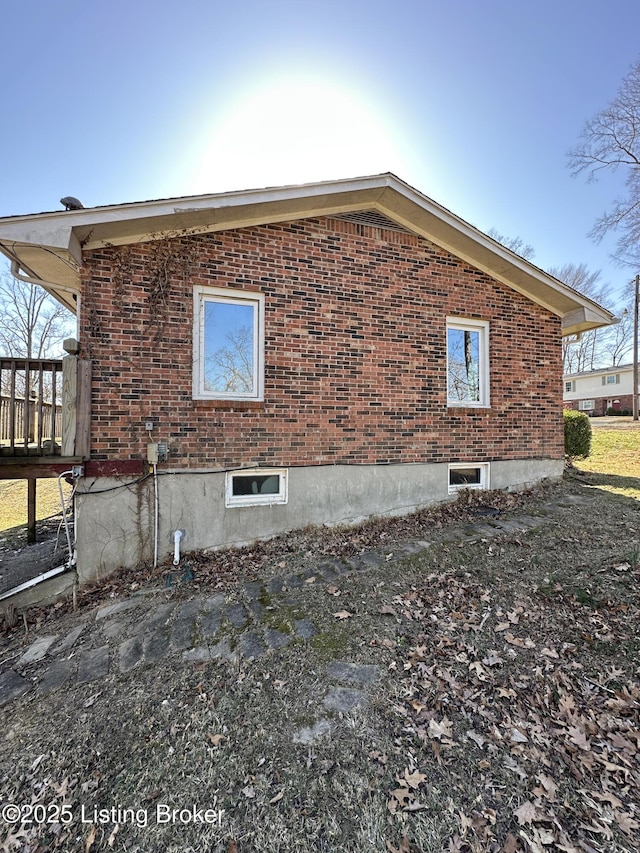 view of home's exterior featuring brick siding