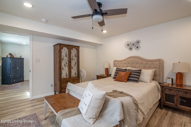 bedroom with recessed lighting, baseboards, light wood finished floors, and ceiling fan