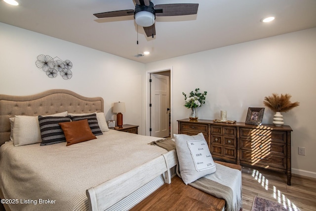 bedroom with recessed lighting, wood finished floors, baseboards, and ceiling fan