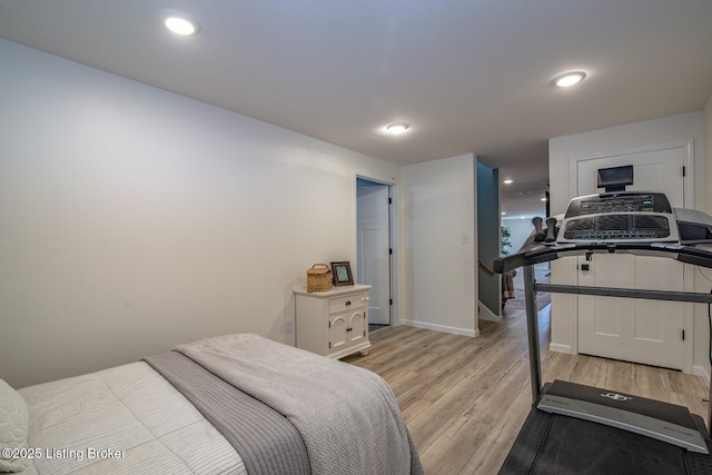 bedroom featuring recessed lighting, baseboards, and light wood-style floors