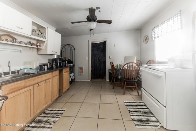 kitchen featuring a sink, open shelves, dark countertops, light tile patterned flooring, and range