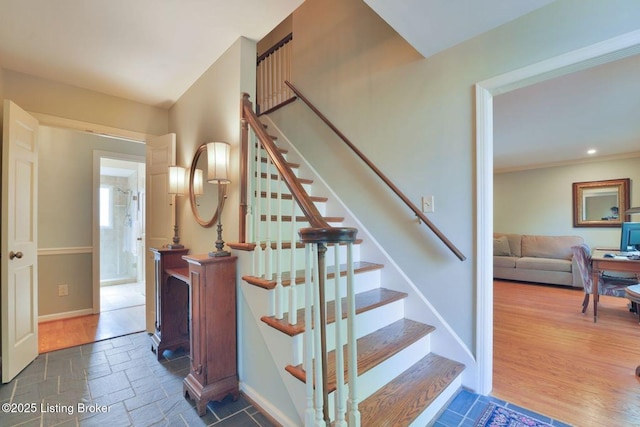 stairway featuring stone tile flooring, recessed lighting, and baseboards