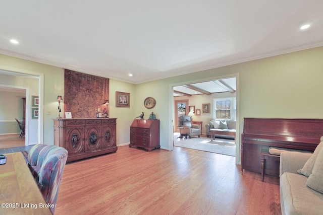 interior space with recessed lighting, ornamental molding, baseboards, and wood finished floors